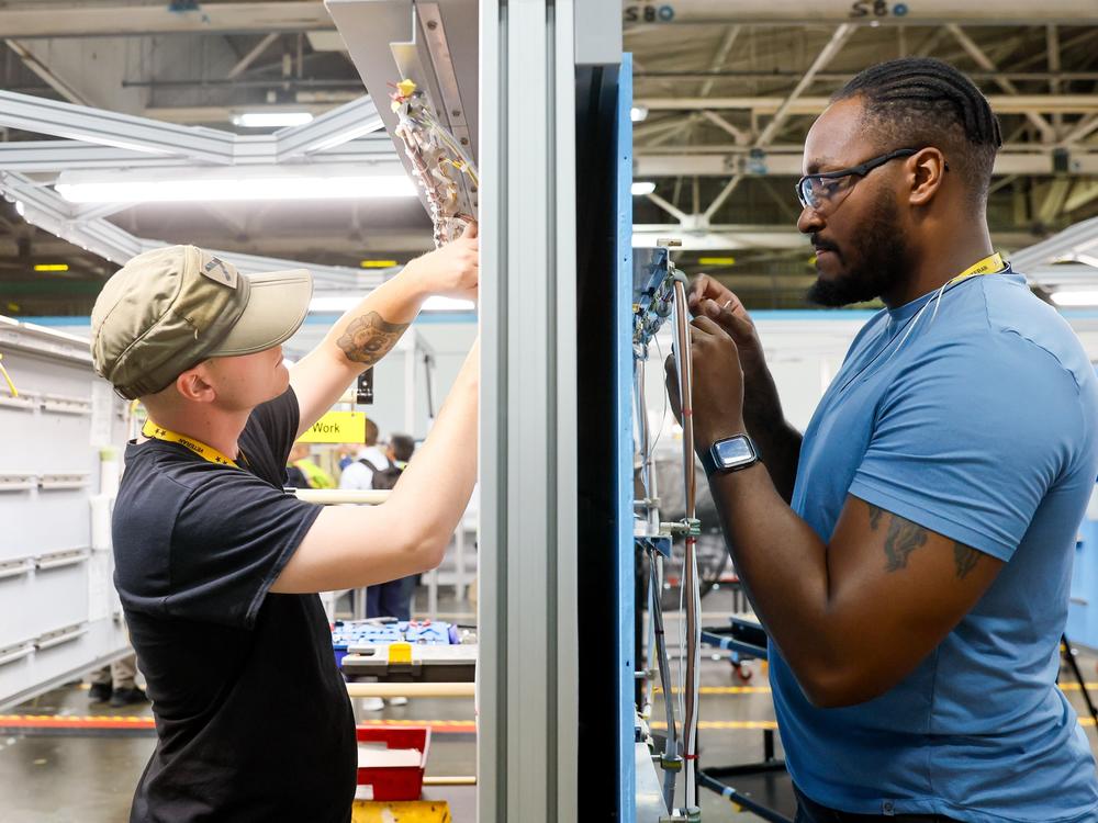 “Every bolt, every washer, every rivet. It all matters,” said Derrick Farmer, right, as he trains on electrical systems with Timothy Well at Boeing's Foundational Training Center on Tuesday.