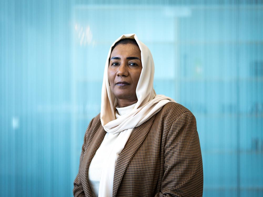Eatizaz Yousif, the Sudan country director for the International Rescue Committee, poses for a portrait at NPR headquarters in Washington, D.C. on June 24. She herself was displaced by the conflict a year ago. “As Sudanese, we are pretty resilient,