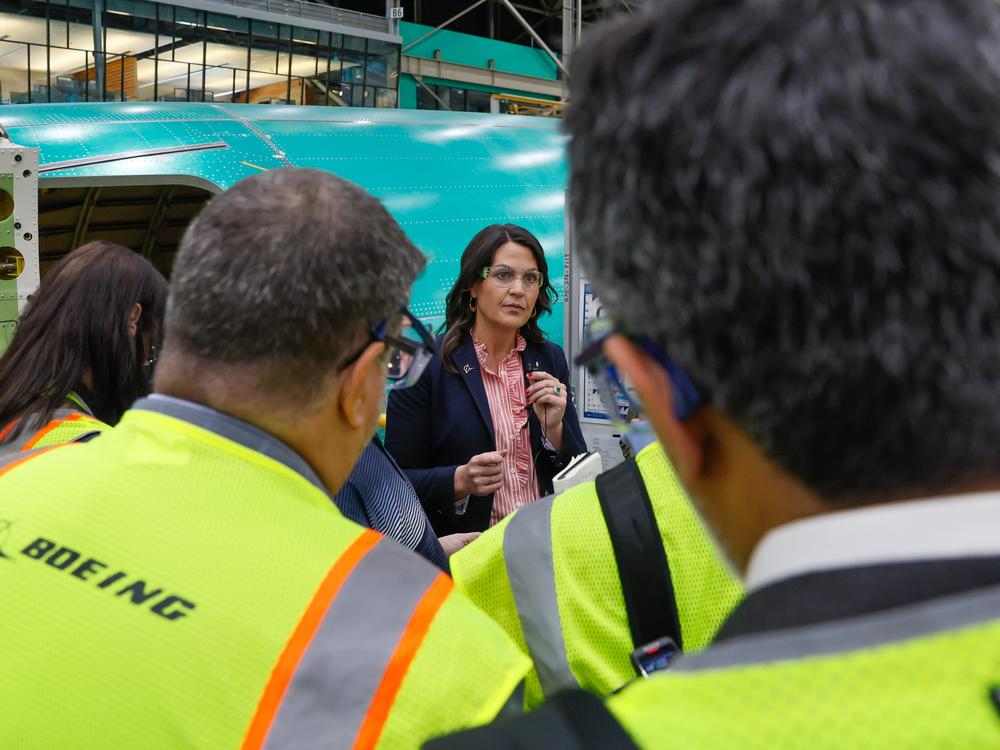 Katie Ringgold, vice president and general manager of the 737 Program, speaks to gathered media at the Boeing 737 factory on Tuesday.