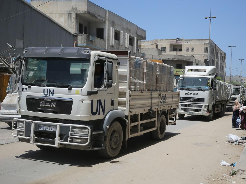 Aid trucks of the United Nations Relief and Works Agency for Palestinian Refugees in the Near East (UNRWA) deliver aid to Salah al-Din Street on the fourth day of Eid al-Adha in the east of Gaza City, Gaza on June 19, 2024.