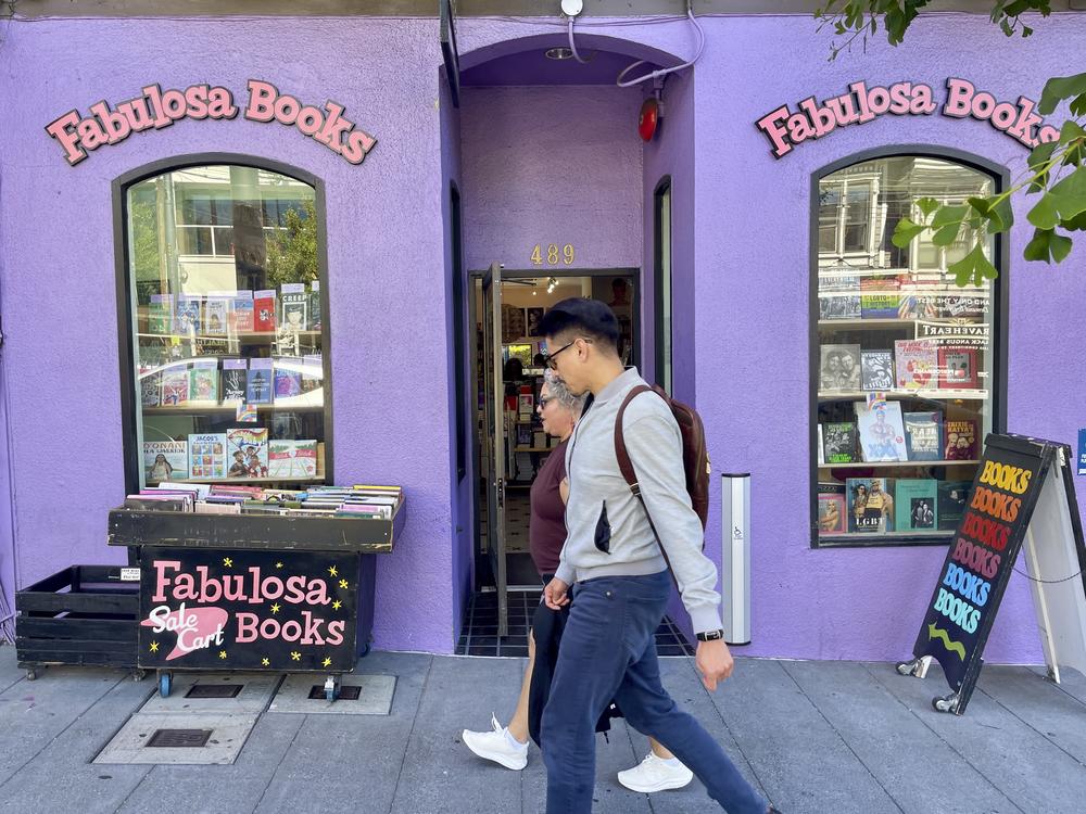 Pedestrians walk past the Fabulosa Books store in San Francisco's Castro District on Thursday. The bookstore is sending LGBTQ+ books to parts of the country where they are censored to counter the rapidly growing effort by anti-LGBTQ+ activists and lawmakers to ban queer-friendly books from public schools and libraries.