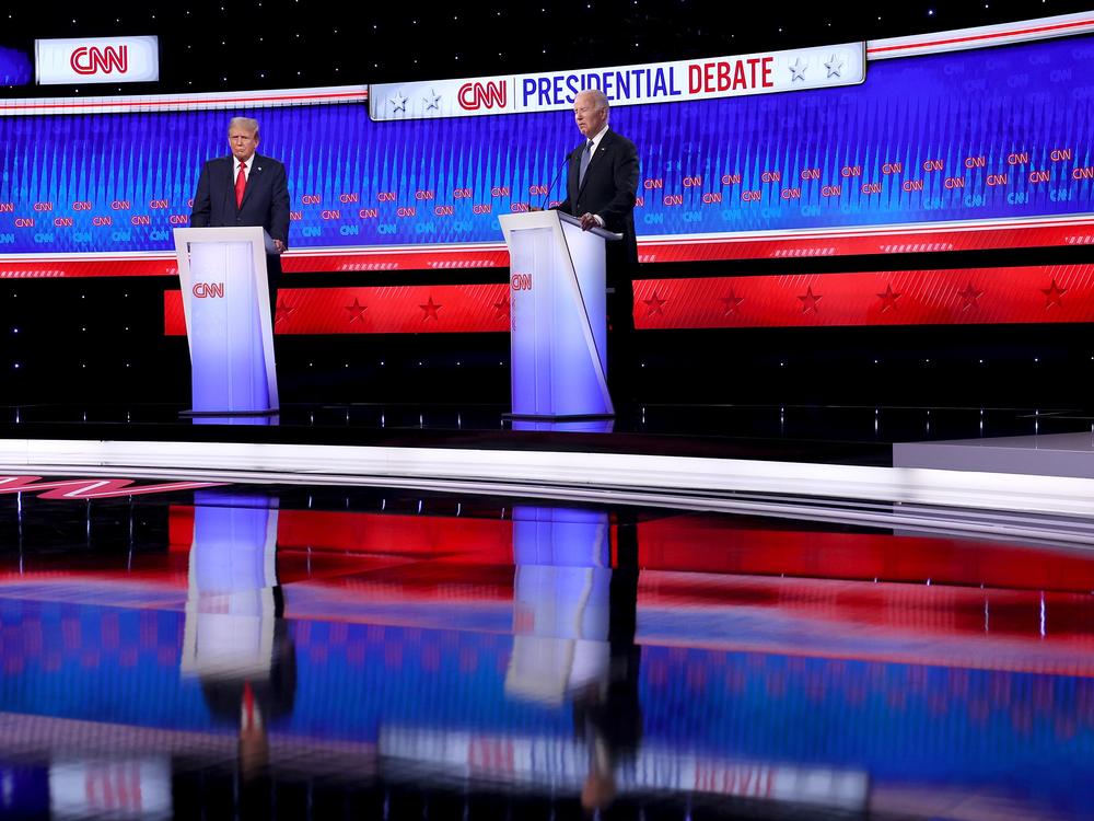 U.S. President Joe Biden (R) and Republican presidential candidate, former U.S. President Donald Trump participate in the CNN Presidential Debate at the CNN Studios on June 27, 2024 in Atlanta, Georgia. 