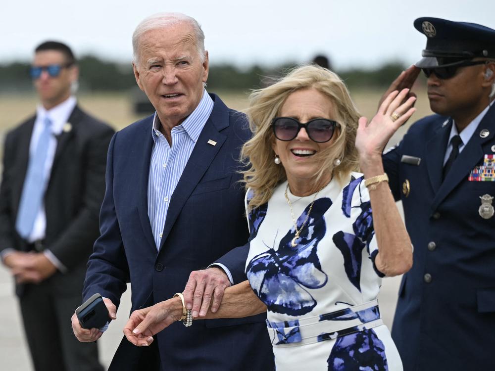 First lady Jill Biden waves as she and President Biden walk from Air Force One in Westhampton Beach, N.Y., on Saturday.