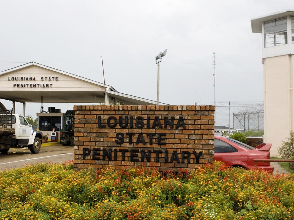 Vehicles enter at the main security gate at the Louisiana State Penitentiary, the largest high-security prison in the U.S. in Angola, La., in August 2008. 
