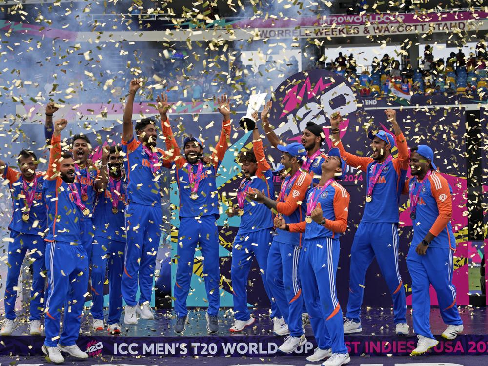 India's players celebrate with the winners' trophy after winning against South Africa in the ICC Men's T20 World Cup final cricket match at Kensington Oval in Bridgetown, Barbados, on Saturday.