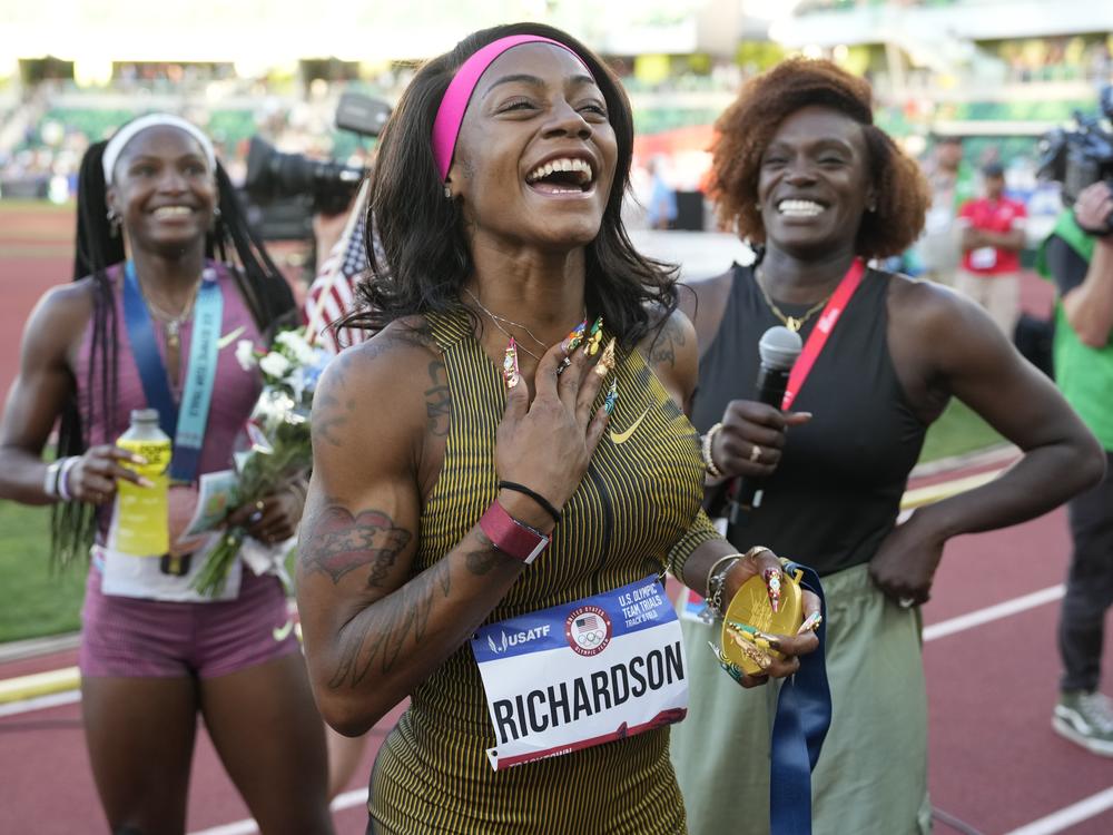 Sha'Carri Richardson celebrates her win in the women's 100-meter finals during the U.S. Track and Field Olympic Team Trials on Saturday in Eugene, Ore.