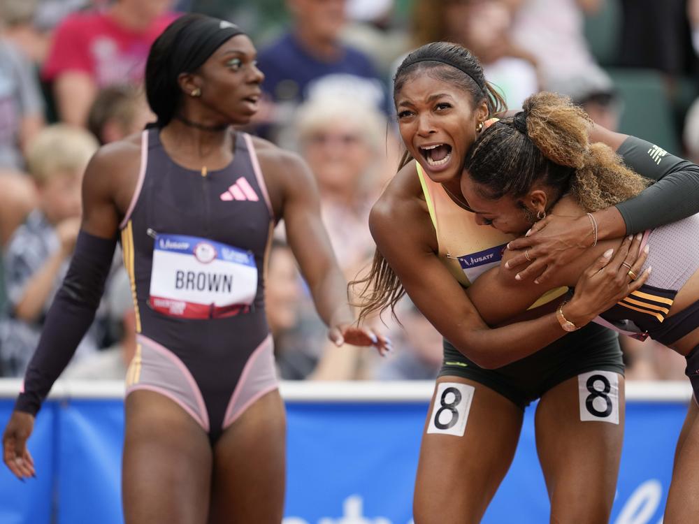 Gabby Thomas celebrates after winning the women's 200-meter final with third place winner McKenzie Long during the U.S. Track and Field Olympic Team Trials on Saturday in Eugene, Ore.