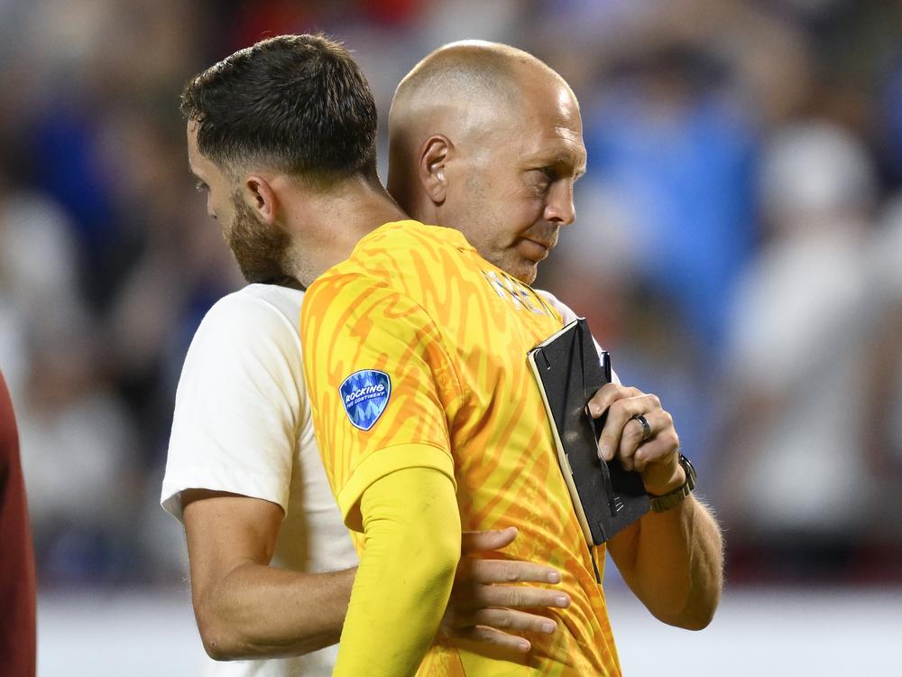 Coach Gregg Berhalter of the United States greets goalkeeper Matt Turner after losing 0-1 against Uruguay at the end of a Copa America Group C soccer match in Kansas City, Mo., on Monday.