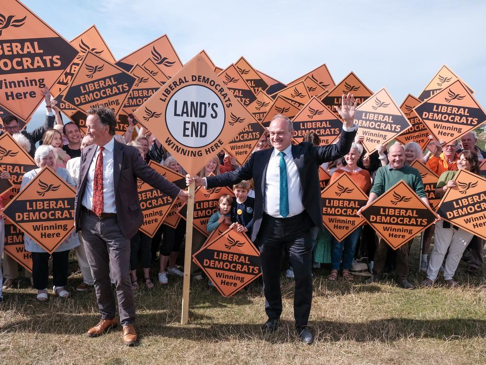 Liberal Democrat leader Ed Davey with parliamentary candidate for St. Ives Andrew George (left), during a visit to Sennen in Cornwall, England, while on the election campaign trail on Tuesday.