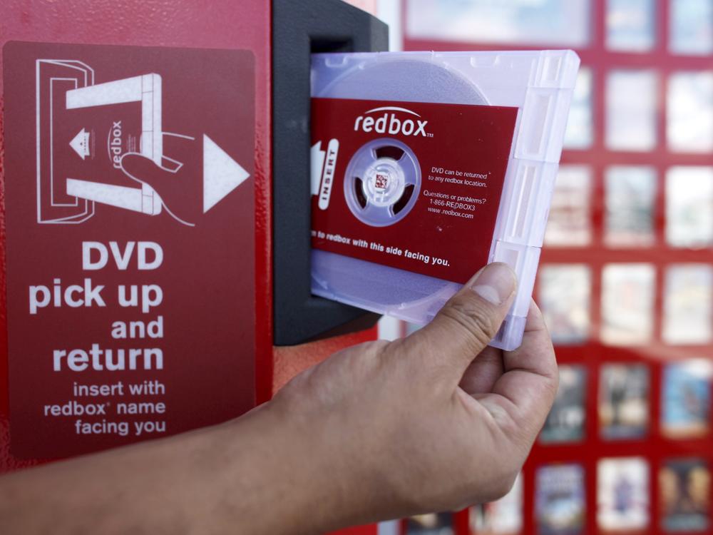 A rental DVD is dispensed from a Redbox at a 7-Eleven in Los Angeles in 2009. Chicken Soup for the Soul Entertainment, the owner of Redbox, filed for Chapter 11 bankruptcy protection on Friday.