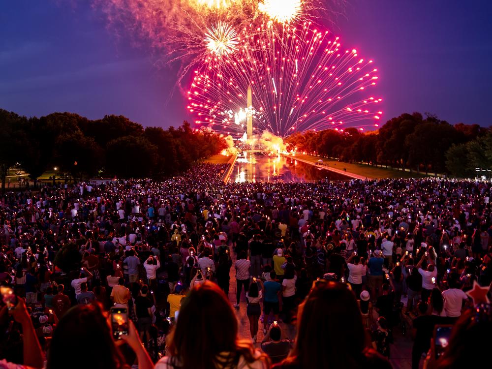 Spectators watch as fireworks erupt over the Washington Monument on July 4, 2022, in Washington, D.C.