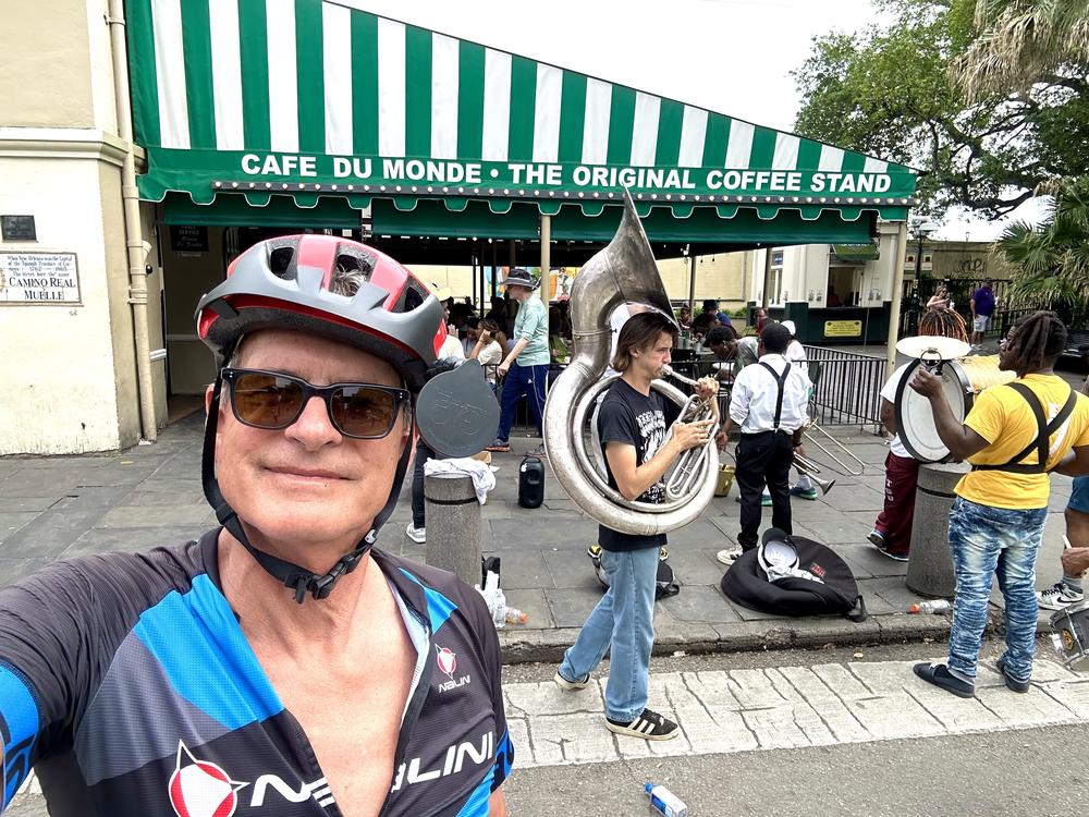 John Burnett takes an end-of-the-road selfie in front of Cafe du Monde, across the street from Jackson Square in New Orleans.