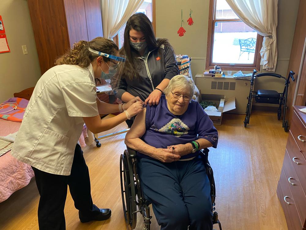 Mary Ann Herbst, a patient at the Good Samaritan Society nursing home in Le Mars, Iowa, gets her first COVID-19 vaccine shot on Dec. 29, 2020. A recent study found only 4 out of 10 nursing home residents in the U.S. have gotten at least one dose of the most recent COVID vaccine, which was released last fall.<br>