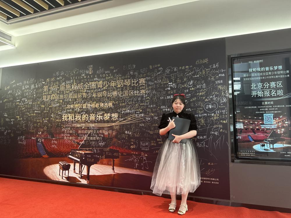  Angela Zhao poses at a piano competition in Beijing in 2023.