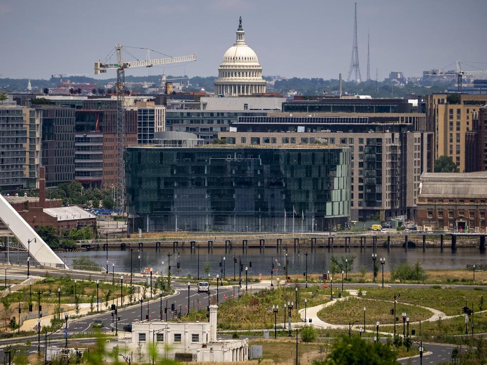 The newly built DC Water Headquarters across the Anacostia River and the Dome of the U.S. Capitol Building are visible from the Department of Homeland Security's St. Elizabeths Campus in Washington, June 15, 2023.