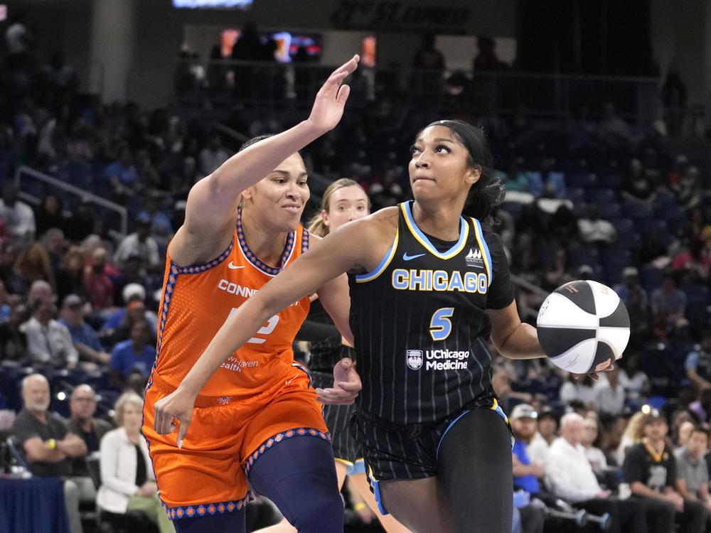 Chicago Sky's Angel Reese (5) eyes the basket as Connecticut Sun's Brionna Jones defends during a WNBA basketball game on June 12, 2024, in Chicago. 
