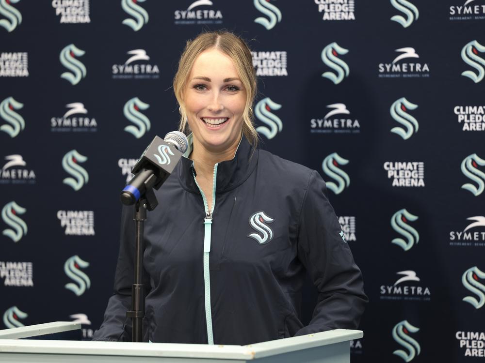 Seattle Kraken new assistant coach Jessica Campbell speaks during an NHL hockey press conference Wednesday in Seattle. Campbell will become the first woman to work on the bench of an NHL franchise after the team hired her as an assistant coach.