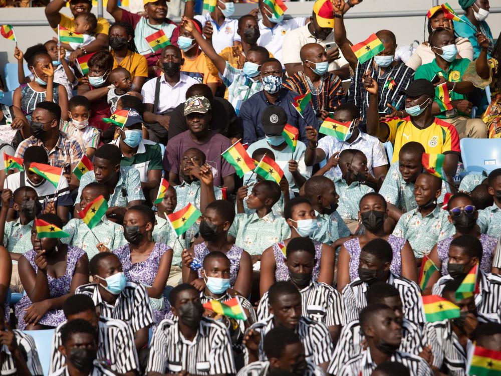 Students cheers from the stands during the celebrations for Ghana 65th Independence Day on March 6, 2022. The country gained independence on March 6, 1957. The author of this article recalls his boyhood celebrations — which involved uniforms, marching and a free bottle of soda.