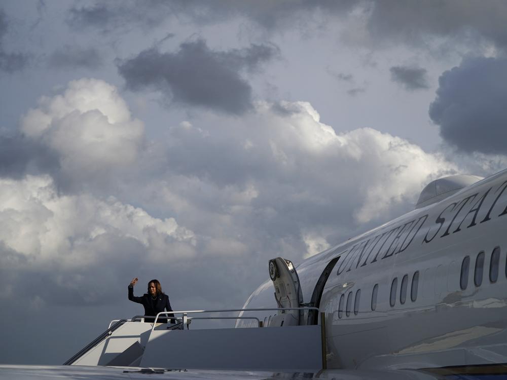 Vice President Harris waves as she boards Air Force Two in Fort Lauderdale, Fla., on March 23, 2024.