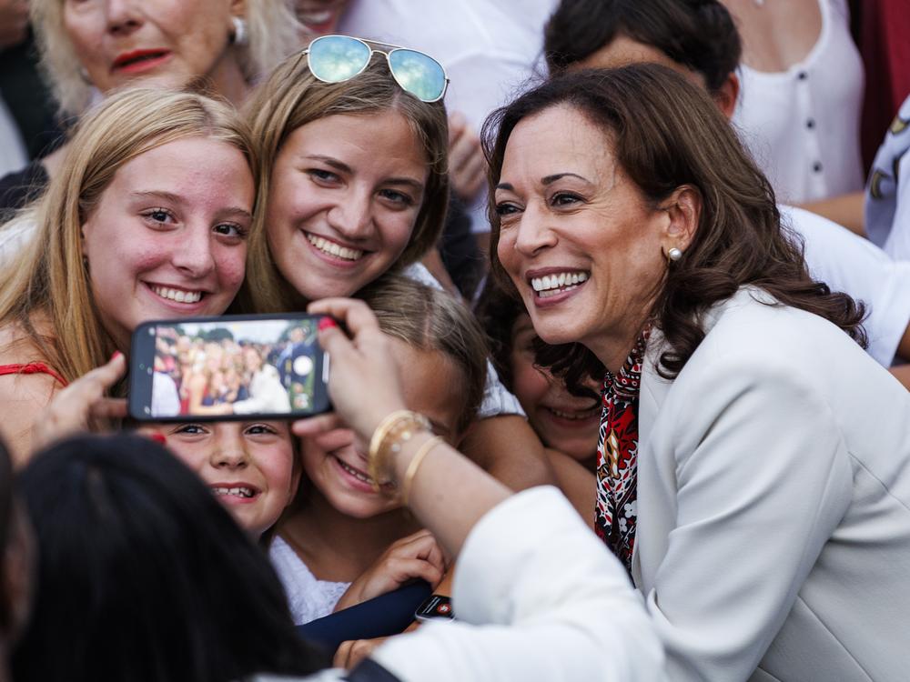 Vice President Harris takes selfies with guests during an Independence Day event on the South Lawn of the White House on July 4, 2024.
