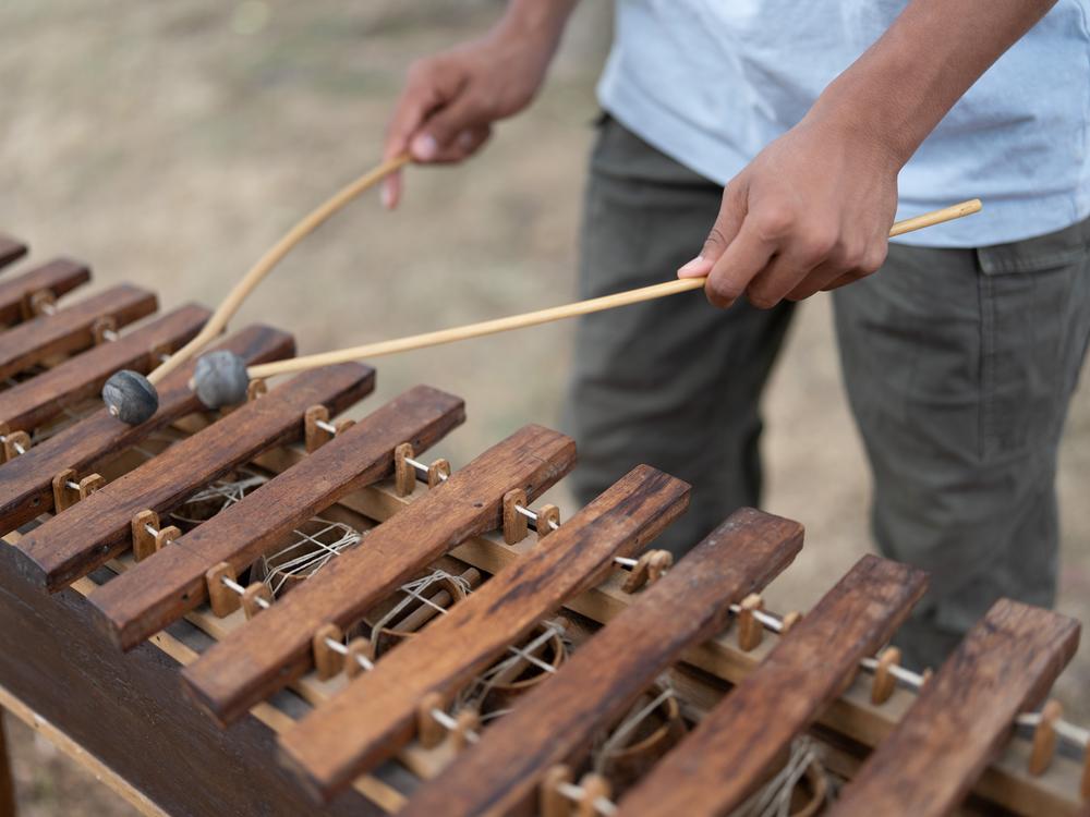 The deft musical hands of 16-year-old Kevin Cabrera Sanchez play a tune on a Guatemalan marimba at the Folklife Festival. It's the national instrument of Guatemala.<br>