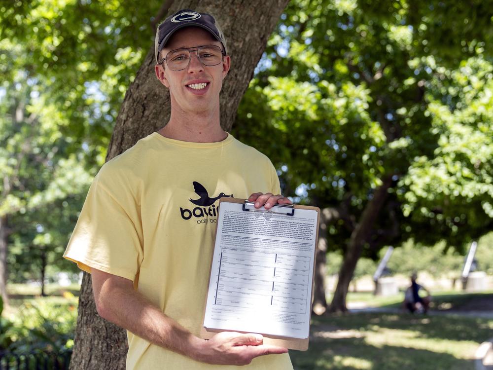 Nate Golden, president of the Maryland Child Alliance, holds a petition form for the Baltimore Baby Fund, on Wednesday in Baltimore.