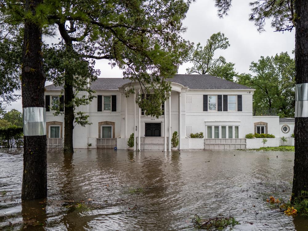 A home is surrounded by floodwater in Texas. Beryl hit the state as a Category-1 hurricane. The remnants of the storm are expected to move far from the ocean toward the Midwest, where they also pose risks of dangerous flooding.