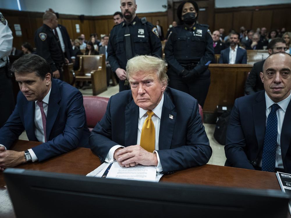 Former President Donald Trump, with attorneys Todd Blanche and Emil Bove, attends his criminal trial at Manhattan Criminal Court on May 29, 2024, in New York.