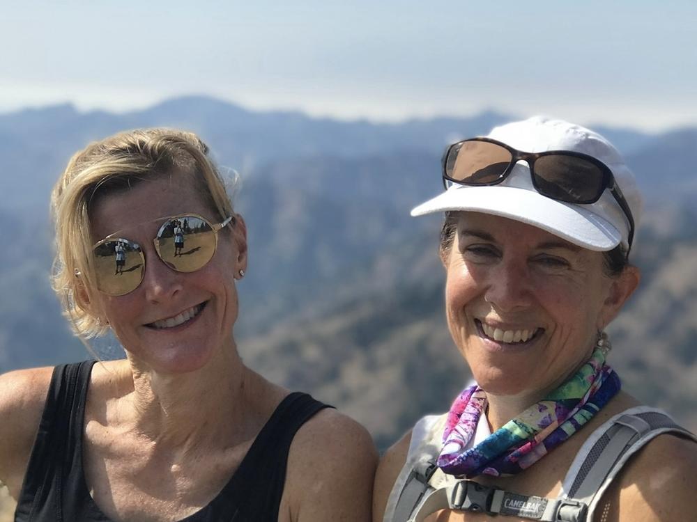  Molly Baker (right) poses with her unsung hero, Carla Vail, who came up with a novel way to support Baker after her husband died.