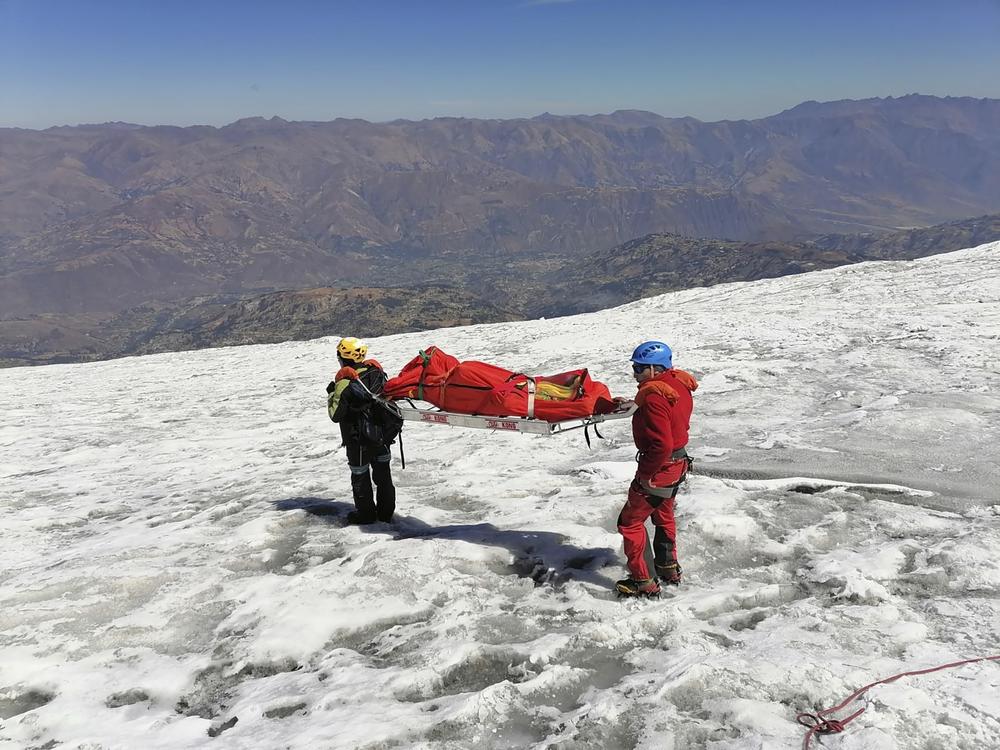 Police carry a body that they identify as U.S. mountain climber Bill Stampfl on Huascaran mountain in Huaraz, Peru, on Friday. Peruvian authorities said they found the mummified body of Stampfl, who died 22 years ago along with two other American climbers after they were trapped in an avalanche while trying to climb Peru's highest peak.