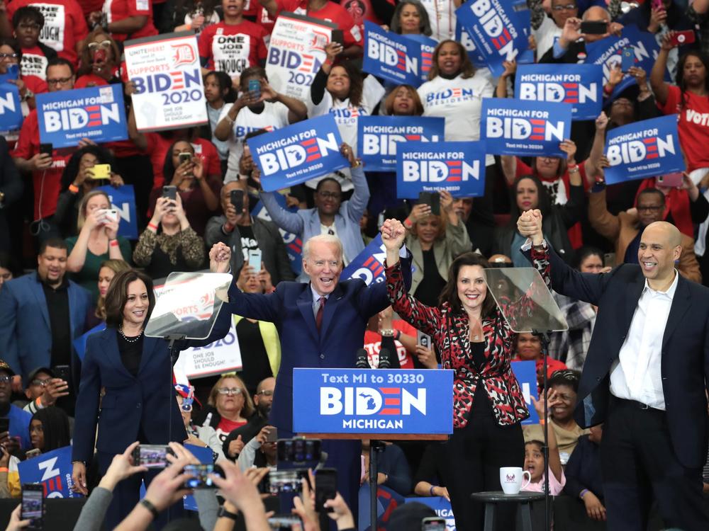 Then-Sen. Kamala Harris (L) (D-CA), Sen. Cory Booker (R)(D-NJ), and Michigan Governor Gretchen Whitmer joined Democratic presidential candidate former Vice President Joe Biden on stage at a campaign rally at Renaissance High School on March 09, 2020 in Detroit, Michigan.
