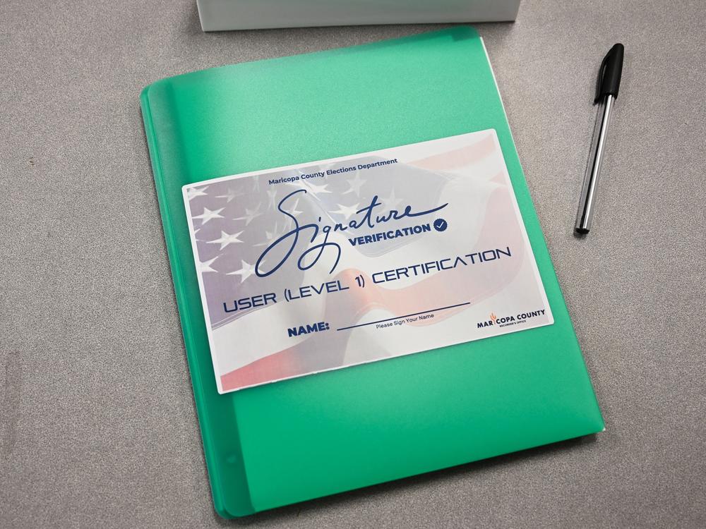 Training materials for election worker signature verification are displayed at the Maricopa County Tabulation and Election Center in Phoenix on June 3.