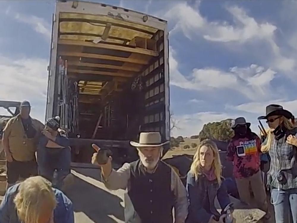 Alec Baldwin gestures while talking with investigators following the fatal on-set shooting that killed cinematographer Halyna Hutchins in October 2021. Video of the conversation was released by the Santa Fe County Sheriff's Office in 2022. 