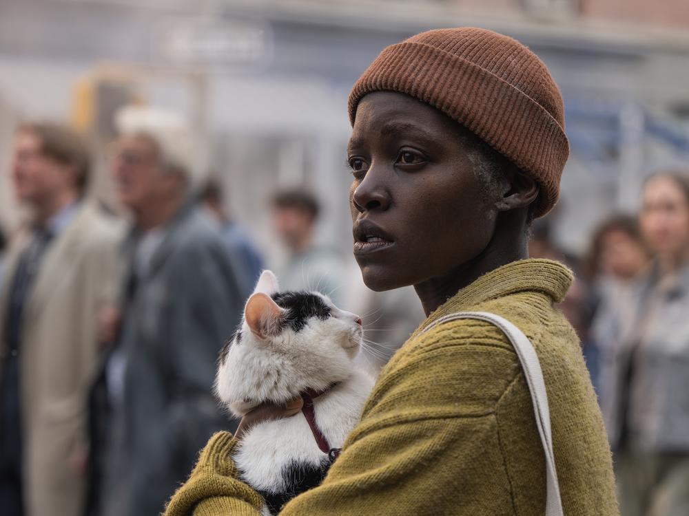 Samira (Lupita Nyong’o) and her cat Frodo try to avoid alien attack in <em>A Quiet Place: Day One.</em>