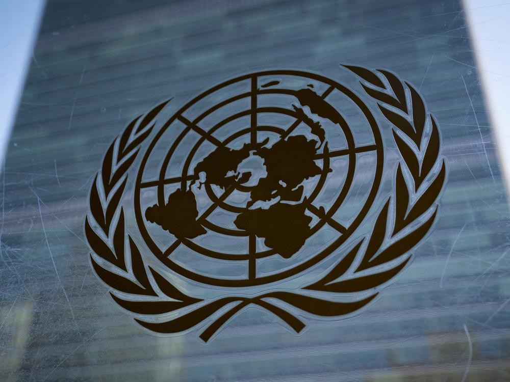 The symbol of the United Nations is displayed outside the Secretariat Building, Feb. 28, 2022, at United Nations Headquarters. 