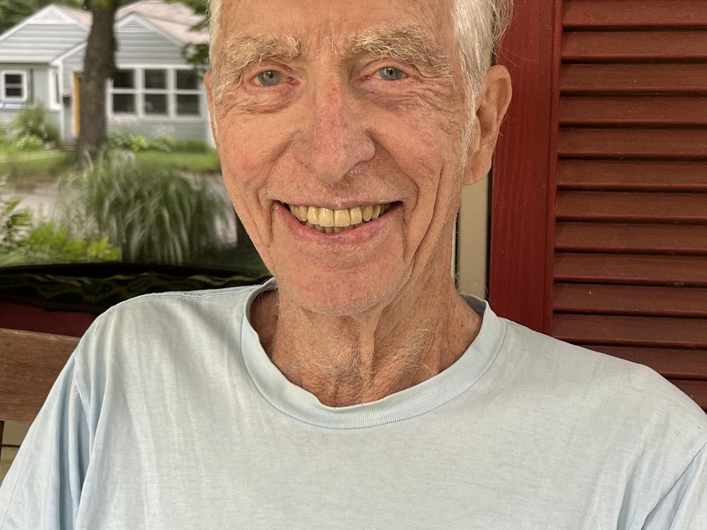  Tom Brush, 90, sits on his porch in Ann Arbor, Mich. Brush wants President Biden to step aside for another Democratic candidate to run in 2024. 