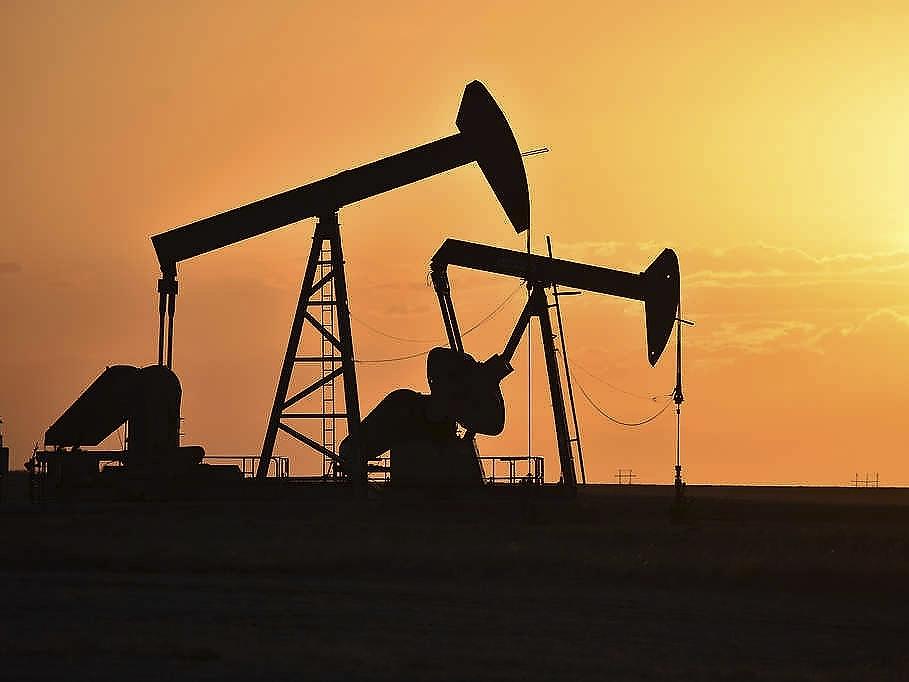 Pump jacks extract oil from beneath the ground in North Dakota on May 19, 2021. The federal government announced a $241.5 million settlement with Marathon Oil on Thursday for alleged air quality violations at the company's oil and gas operations in the Forth Berthold Indian Reservation in North Dakota. 