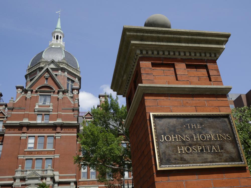 A sign stands in front of part of the Johns Hopkins Hospital complex in Baltimore.