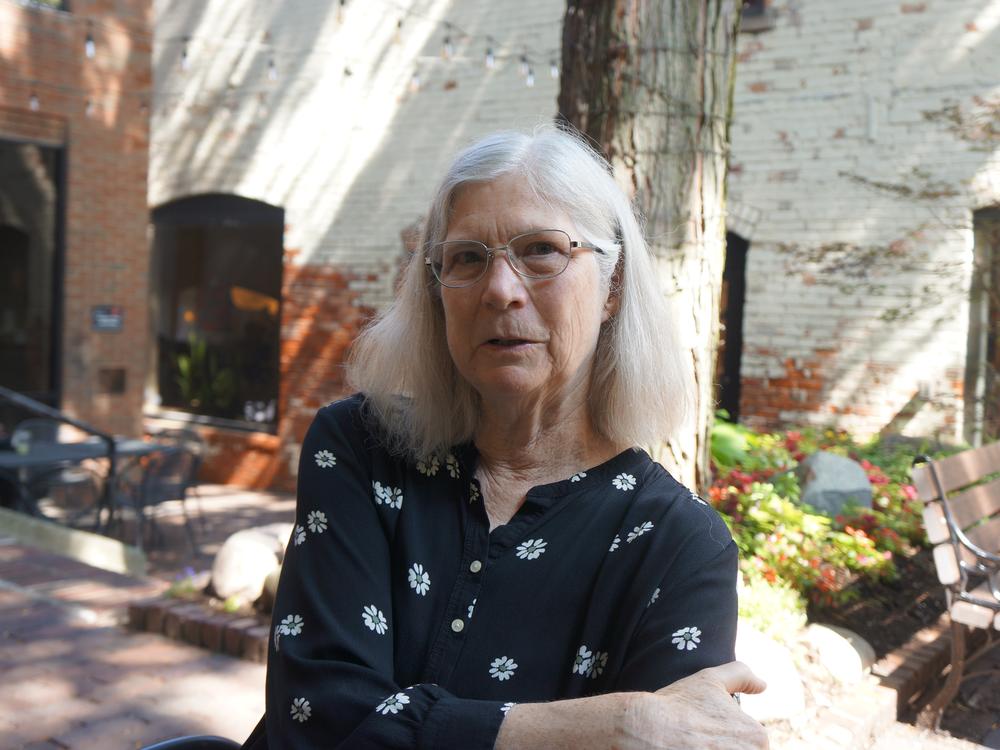  Janet Cannon stands outside a coffee shop in Ann Arbor, Mich. Cannon is on the executive committee of the Washtenaw Democratic Party and she also volunteers as an organizer. 