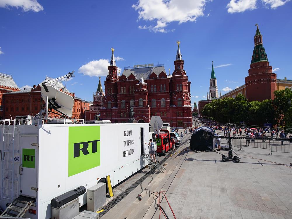 Russian state broadcaster RT broadcasting from near Red Square during the 2018 World Cup in Moscow. The Justice Department alleges an RT employee was behind an AI-powered effort to create fake social media profiles of Americans to spread Russian propaganda in the U.S. 