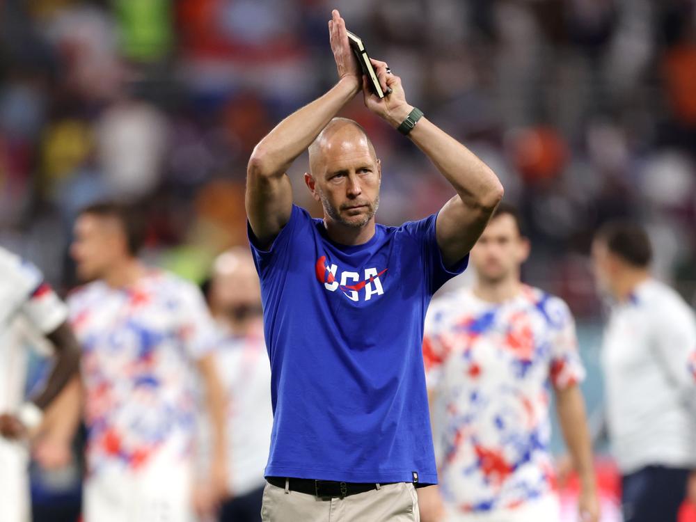 Then-USMNT coach Gregg Berhalter applauds fans after the team's defeat during the FIFA World Cup Qatar 2022 against the Netherlands in 2022.