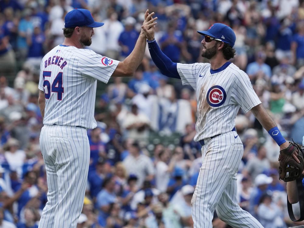 Chicago Cubs relief pitcher Colten Brewer, left, celebrates with Dansby Swanson after the Cubs defeated the San Francisco Giants 6-5 in a baseball game in Chicago, Wednesday, June 19, 2024. 