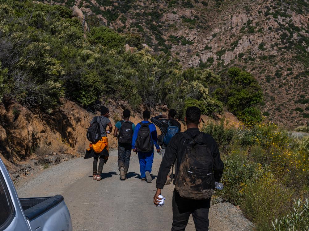 Volunteers with Border Relief Collective provide aid to migrants in the Otay Mountain Wilderness near San Diego, California. Dozens of migrants seeking asylum come through the intensely rugged area each day.