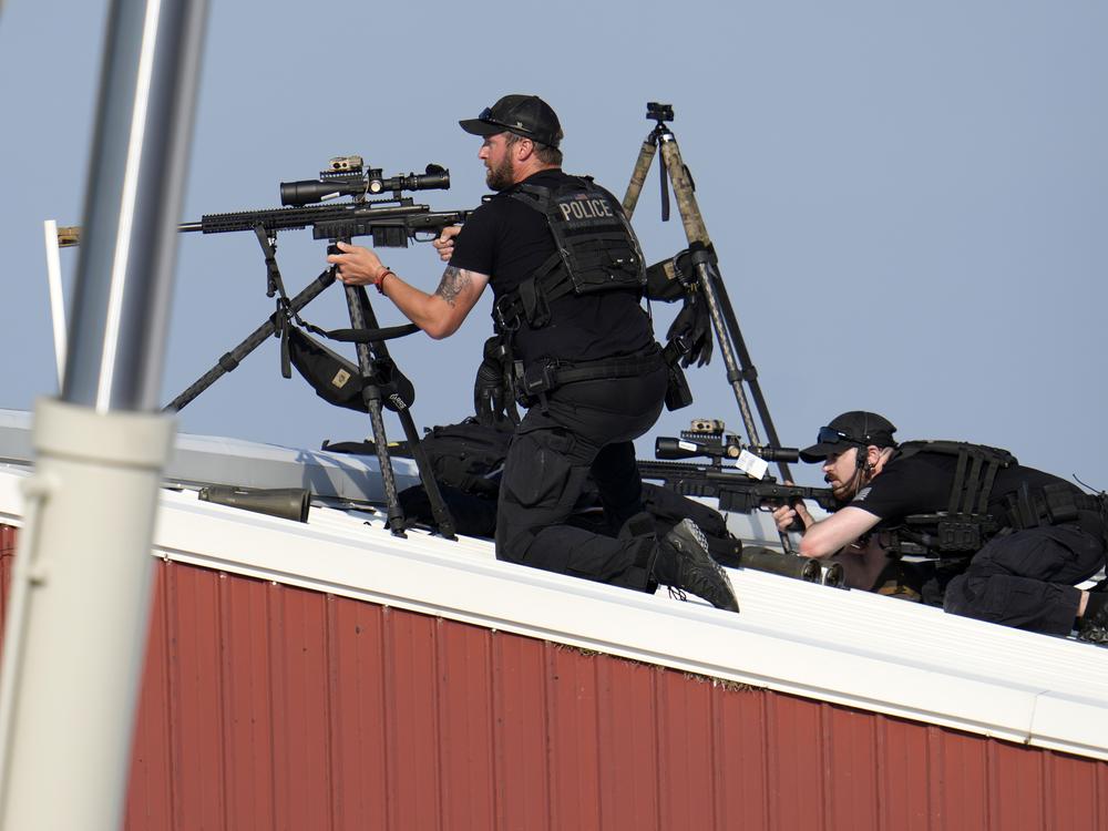 Police snipers return fire after shots were fired while Republican presidential candidate former President Trump.