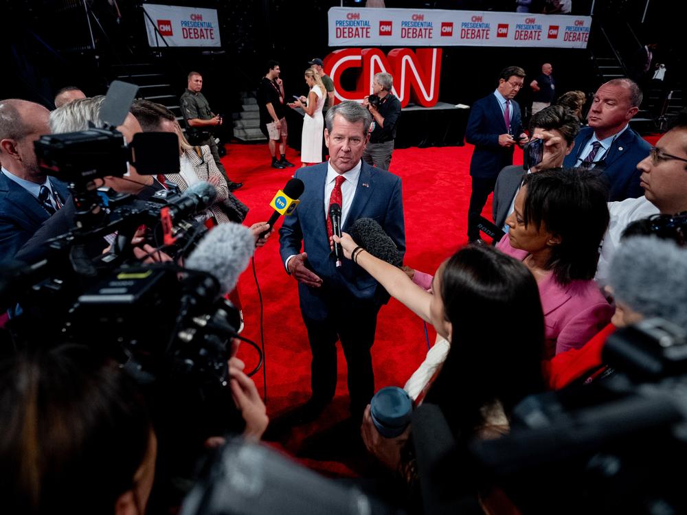 Georgia Gov. Brian Kemp speaks to reporters ahead of a CNN Presidential Debate on June 27, 2024, in Atlanta. 