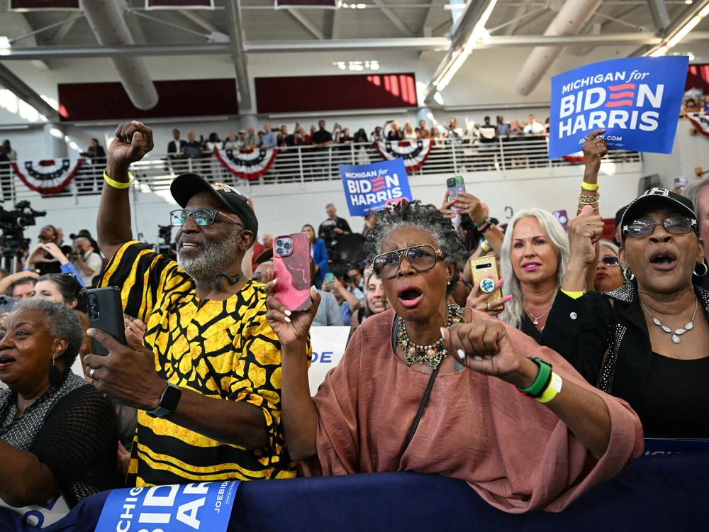 Supporters cheer as President Biden arrives at Renaissance High School in Detroit on July 12.