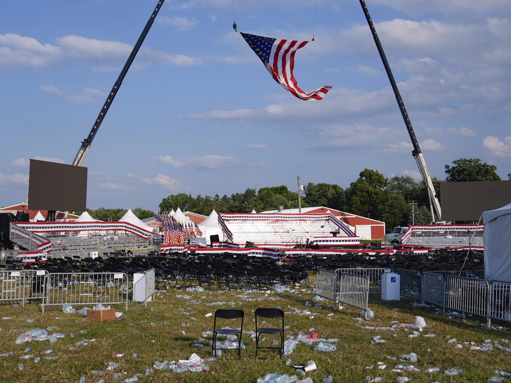 A campaign rally site for Republican presidential candidate former President Trump is empty and littered with debris.