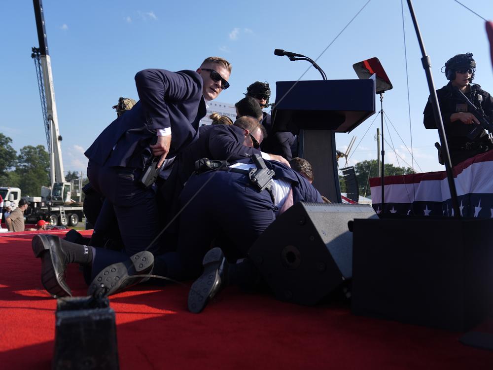 Republican presidential candidate former President Trump is surrounded by U.S. Secret Service agents.