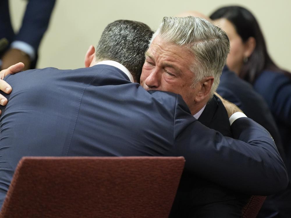 Actor Alec Baldwin hugs his attorney Alex Spiro.