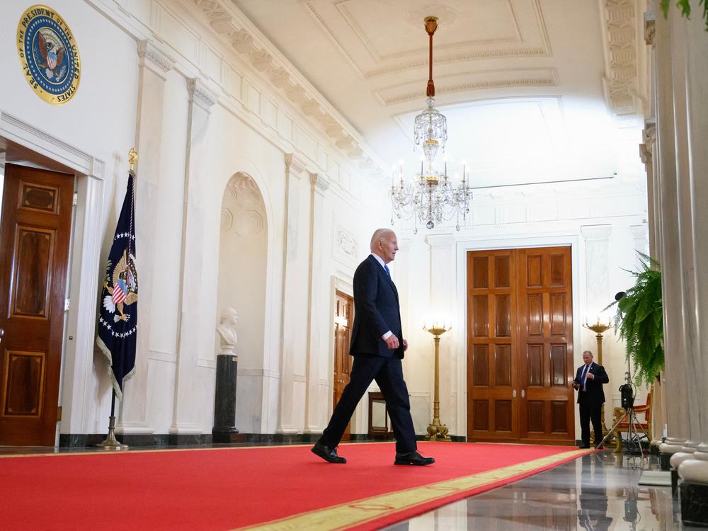 President Biden walks through the Cross Hall of the White House on July 1.